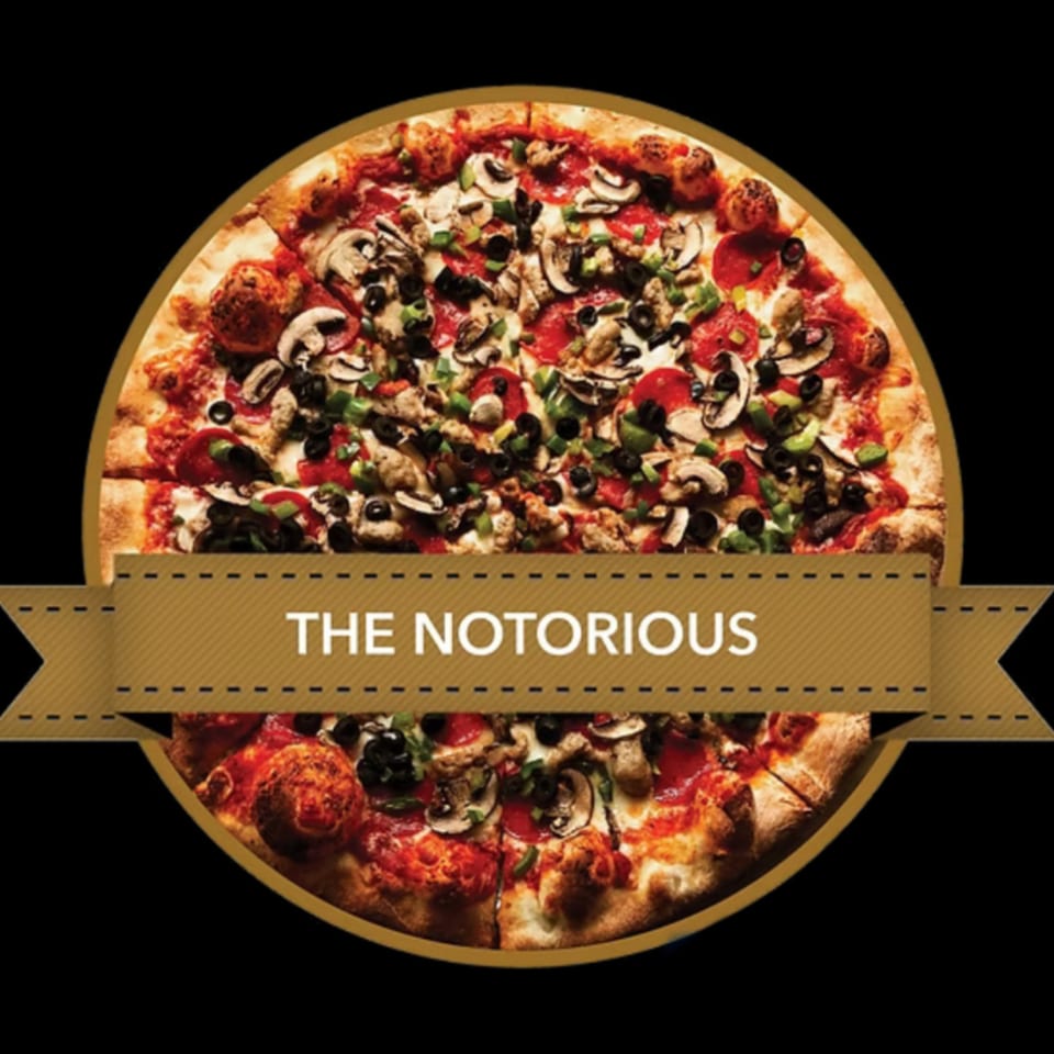 Mikey's Pizza "The Notorious" pizza, topped with pepperoni, mushrooms, olives, and green peppers.